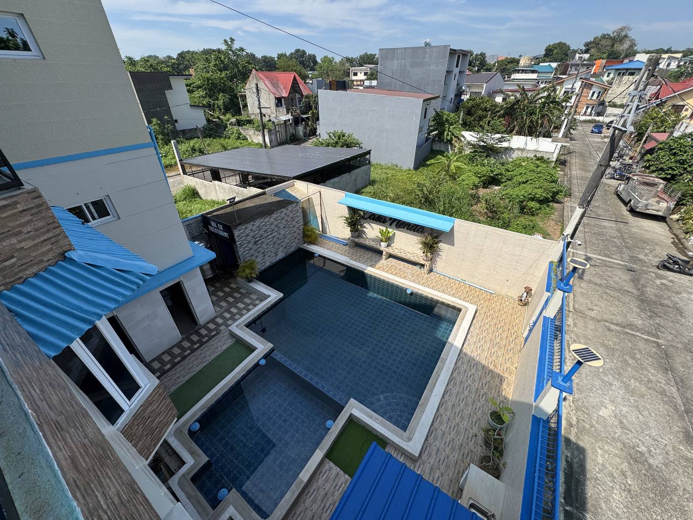 Looking down over the pool and house