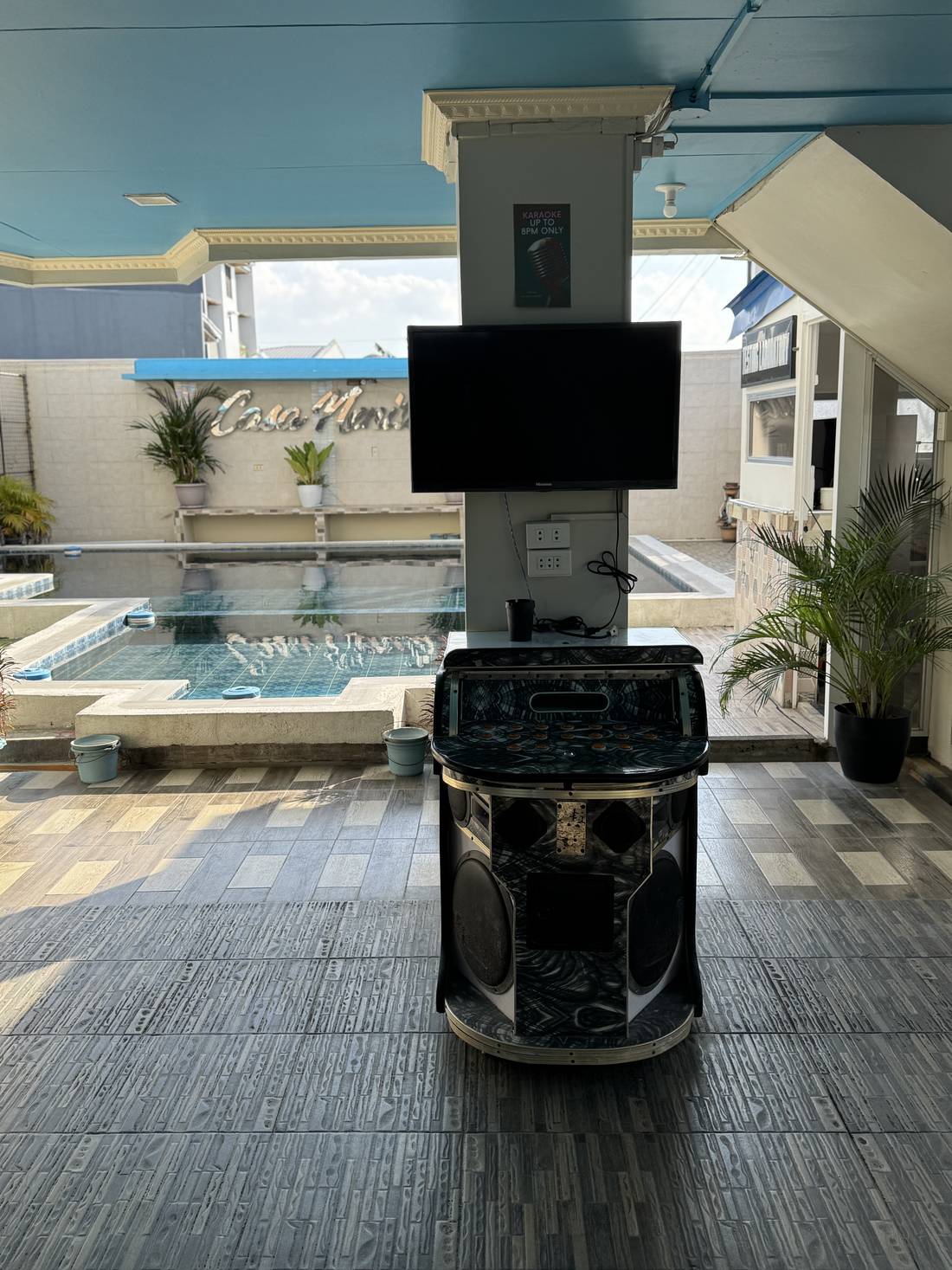 Karaoke machine set up beside the pool